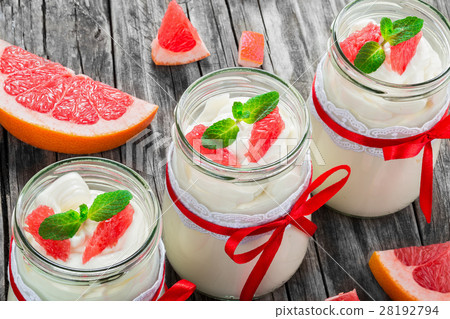 yogurt with grapefruit and mint in a glass jars yogurt with grapefruit and mint in a glass jars 28192794