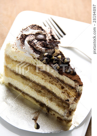 Tiramisu cake on a white plate 28194897