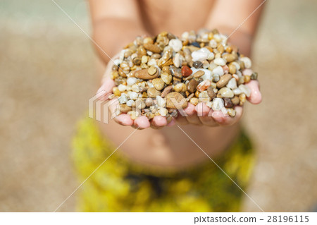 Child hands with pebbles Child hands with pebbles 28196115