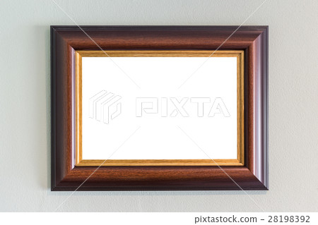 Wooden photo frame hanging on the wall. Interior decoration Wooden photo frame hanging on the wall. Interior decoration 28198392
