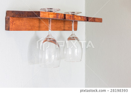Wine glasses place on the wooden rack Wine glasses place on the wooden rack 28198393