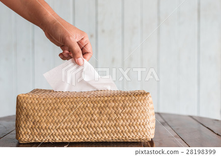 Hand picking white piece tissue paper from box Hand picking white piece tissue paper from box 28198399