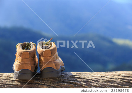 New brown leather shoe on mountain view point. Adventure concept 28198478