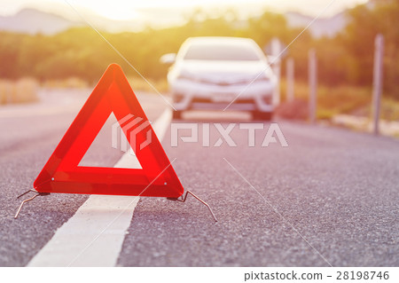 Emergency stop sign and broken silver car on the road Emergency stop sign and broken silver car on the road 28198746