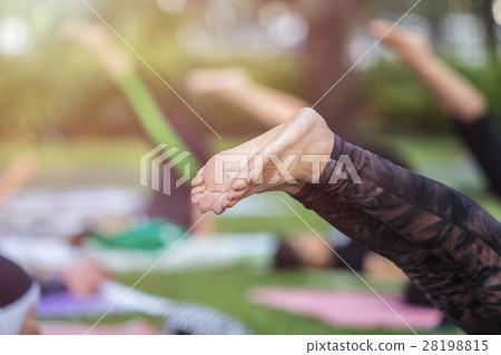 Asian woman doing yoga or exercise in the park Asian woman doing yoga or exercise in the park 28198815