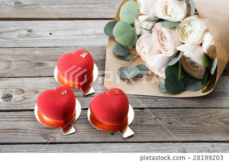 Red heart cacke desserts and buttercups on wooden Red heart cacke desserts and buttercups on wooden 28199203
