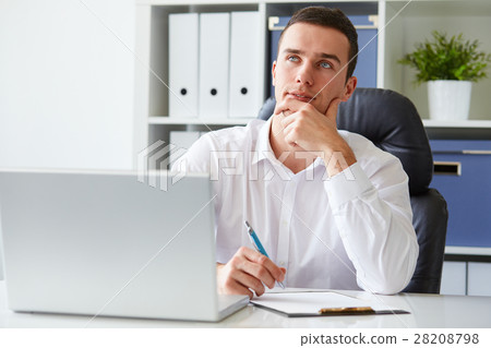Man in a polo shirt stands leaning on railing Man in a polo shirt stands leaning on railing 28208798