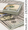 Stack of money in US dollars cash banknotes 28209459