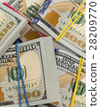 Packs of hundred dollar bills 28209770