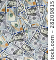 Heap of money in hundred dollar banknotes spread on surface 28209815