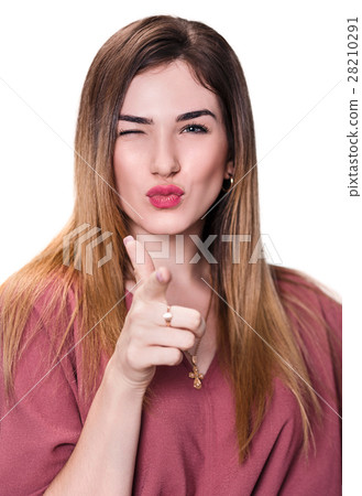 Young woman winks and point at you 28210291