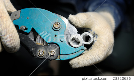 Close up view on pipe cutter Close up view on pipe cutter 28210626