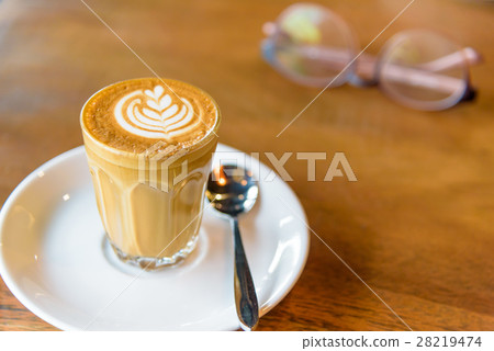 A cup of hot coffee in morning. 28219474