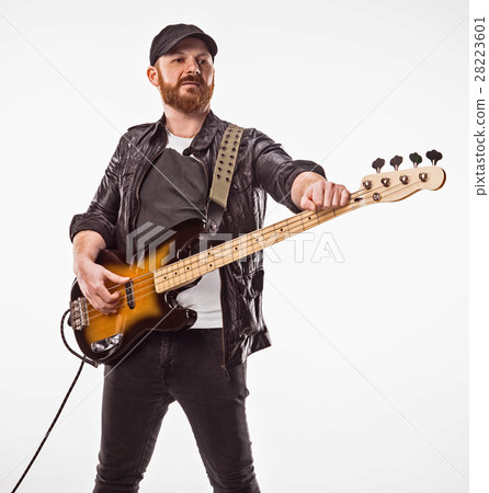 Bassist plays bass guitar. 28223601