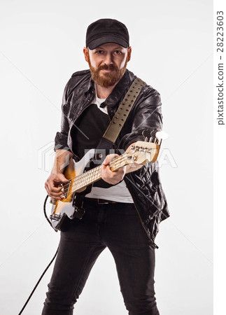 Bassist plays bass guitar. 28223603