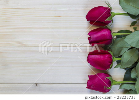 Red roses on wooden background for valentine day. 28223735
