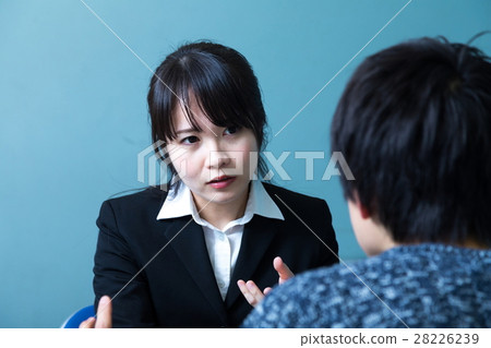 Female police officer male suspect interrogation interrogation room 28226239