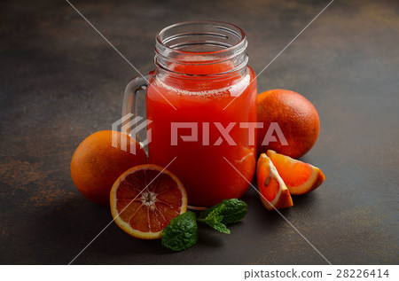 Fresh blood orange juice in mason jar. 28226414