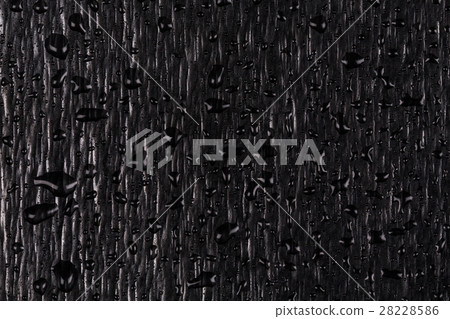 Water drops on dark stone Water drops on dark stone 28228586