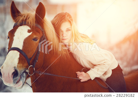 Girl laying on horse neck. Friendship background Girl laying on horse neck. Friendship background 28229182
