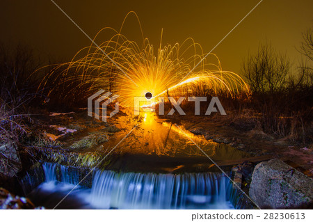 Burning sparks in the night winter landscape Burning sparks in the night winter landscape 28230613