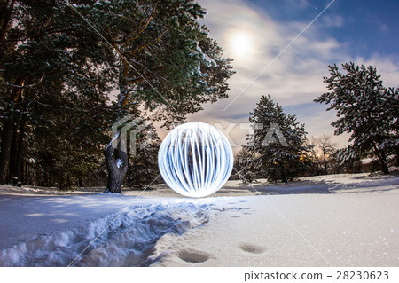 Luminous sphere in a night winter forest Luminous sphere in a night winter forest 28230623