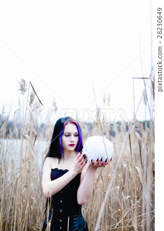 Portrait of the gothic woman with the skull 28230649