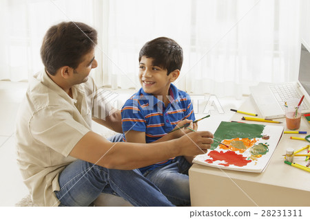 Father and son painting with water colors 28231311