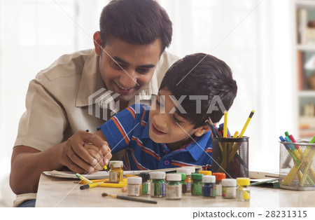 Father and son painting crafts at home Father and son painting crafts at home 28231315