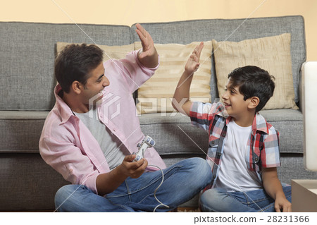 Father and Son Playing Video Game Father and Son Playing Video Game 28231366