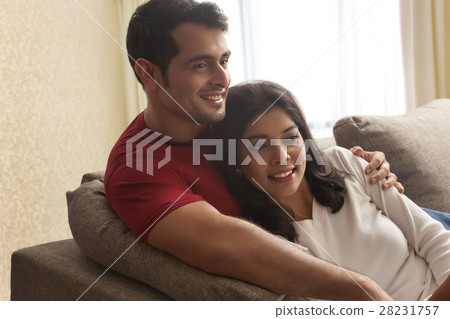 Close-up of young couple watching television Close-up of young couple watching television 28231757