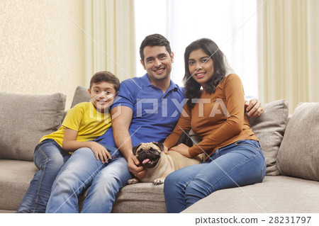 Portrait of smiling parents with son and pug Portrait of smiling parents with son and pug 28231797