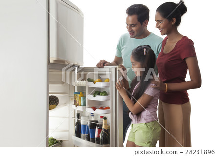 Family looking into open refrigerator Family looking into open refrigerator 28231896