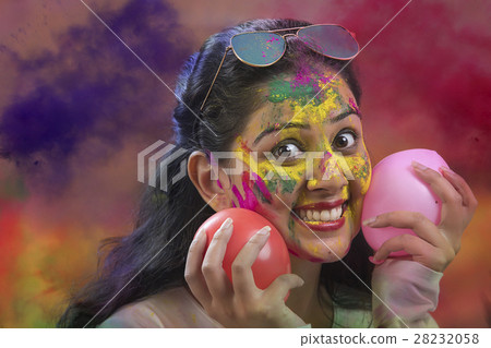 Indian Happy Young Girl With Holi Balloons at Holi Festival 28232058