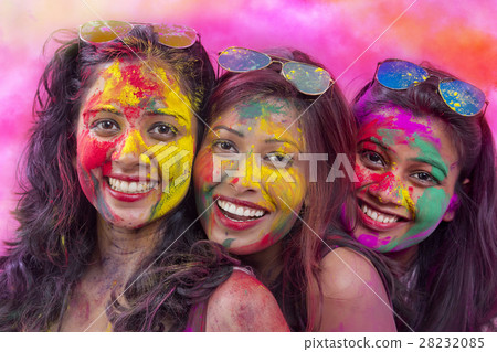 Portrait Of Three Young Indian Women With Colored Face celebrating Holi Color festival 28232085