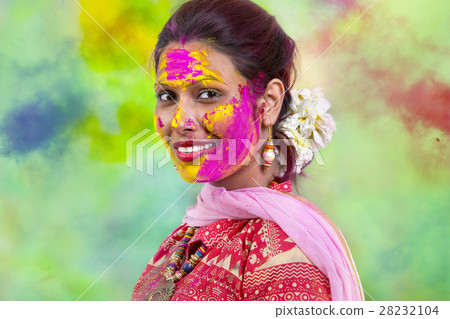 Portrait of  young Indian Woman celebrating Holi color festival 28232104