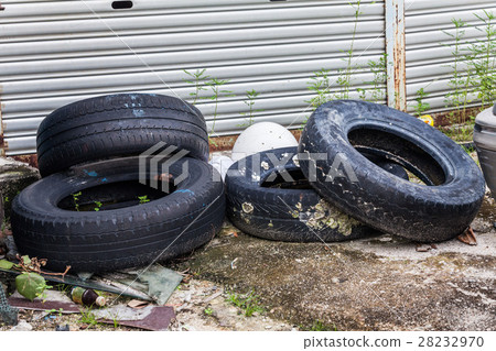 Old tire indicating breeding ground for mosquito Old tire indicating breeding ground for mosquito 28232970