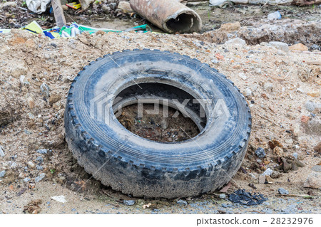 Old tire indicating breeding ground for mosquito Old tire indicating breeding ground for mosquito 28232976