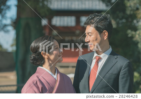 visiting shrine or temple, husband and wife, married couple 28246428