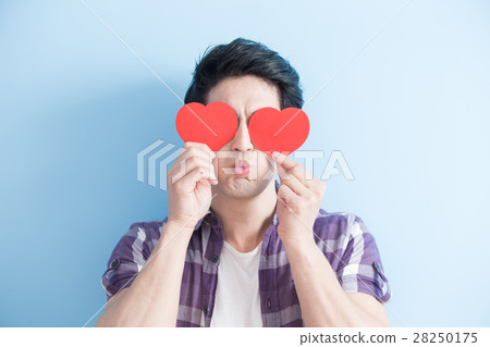young man holding love hearts 28250175