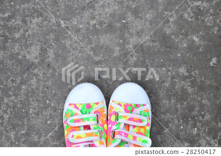 Colorful Sneakers on Gray Asphalt Road 28250417