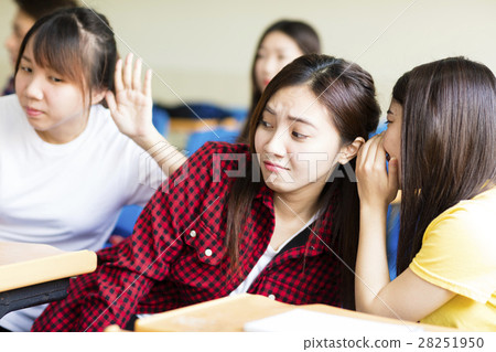 happy student girl gossiping in classroom 28251950