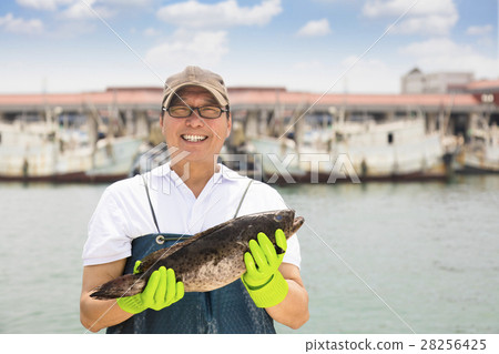 happy fisherman showing fish before fishing ship happy fisherman showing fish before fishing ship 28256425