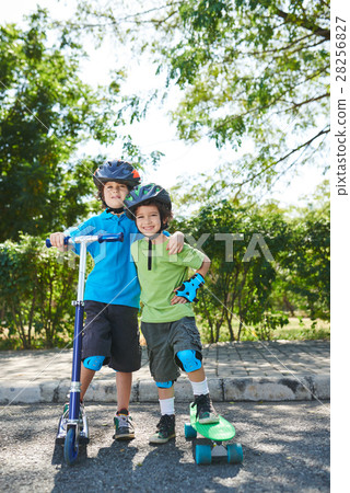 Little sportsmen in sunny park Little sportsmen in sunny park 28256827