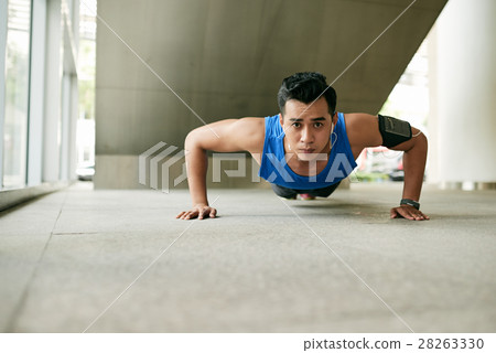 Asian man doing plank exercise Asian man doing plank exercise 28263330