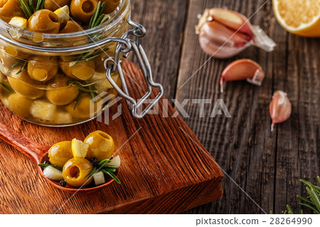 Fresh olives with rosemary, garlic, lemon. 28264990