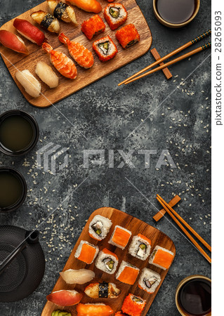 Sushi Set: sushi and sushi rolls on wooden plate. 28265093