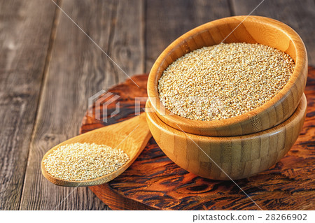 White quinoa in a wooden bowl. White quinoa in a wooden bowl. 28266902
