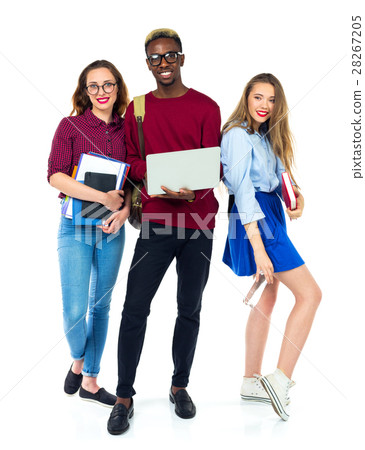 Three students standing and smiling with books Three students standing and smiling with books 28267205