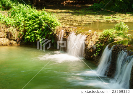 Little tropical waterfall in jungle in thailand Little tropical waterfall in jungle in thailand 28269323